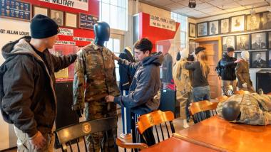 ROTC cadets Tore Sclafani, left, and Matthew Donahue adjust uniforms during preparation for the “Fit for Duty: Form and Function in Military Dress” exhibition.