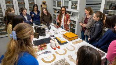 Denise Green shows students around the Cornell Fashion + Textile Collection and highlights artifacts on loan from the family of Ruth Bader Ginsburg ’54.