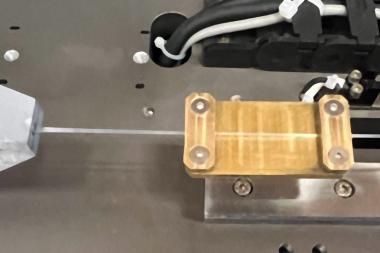 In experiments, MIT engineers demonstrate a fiber, made from a common polymer material, changes its ability to handle heat as it is stretched.